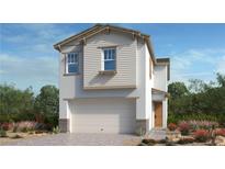 Charming two-story home with a two-car garage and landscaped front yard at 643 N Water St, Henderson, NV 89015