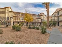 Exterior view of a two-story apartment building with landscaping and walkways at 2080 Karen Ave # 39, Las Vegas, NV 89169