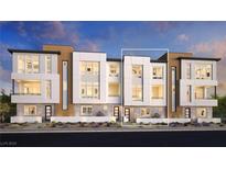 Modern three-story townhome community with attached garages at 655 Agate Bridge St, Las Vegas, NV 89138