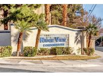 RidgeView Condominiums entrance with palm trees and landscaping at 1951 Scimitar Dr # 1951, Henderson, NV 89014