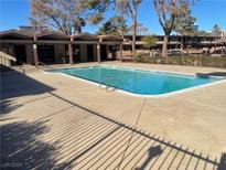 Refreshing community pool with surrounding patio at 565 S Royal Crest Cir # 19, Las Vegas, NV 89169
