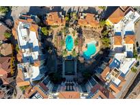 Complex featuring a large pool and well-maintained landscaping at 30 Strada Di Villaggio # 227, Henderson, NV 89011