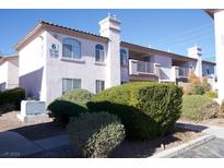 Two-story building with light-colored walls and landscaping at 4555 E Sahara Ave # 223, Las Vegas, NV 89104