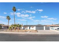 Charming single-story home with a landscaped front yard and attached garage at 4620 Cinderella Ln, Las Vegas, NV 89102