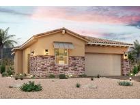 Tan two-story house with stone accents and a two-car garage at 168 Caraset Ln, Henderson, NV 89011