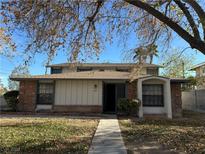 Brick house with a walkway and tree in front at 4710 Roberta St # 1, Las Vegas, NV 89119