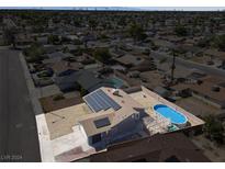 Aerial view of house, solar panels, pool, and surrounding neighborhood at 5280 Plainview Ave, Las Vegas, NV 89122