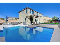 Two-story home with sparkling pool, spa, and covered patio at 10281 Grey Pine Ct, Las Vegas, NV 89166