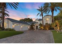 Stunning curb appeal with a large driveway and palm trees at 2337 Prometheus Ct, Henderson, NV 89074