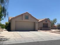 Single-story house with attached garage and desert landscaping at 2532 Big Timber Dr, Las Vegas, NV 89134