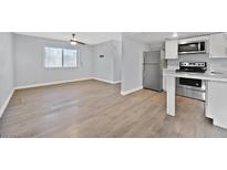Modern kitchen with stainless steel appliances and white cabinets at 3801 Daisy St # 40, Las Vegas, NV 89119