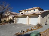 Two-story house with three-car garage and landscaped yard at 4316 Cinema Ave, North Las Vegas, NV 89031