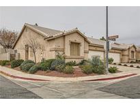 Single-story house with landscaped front yard and two-car garage at 1195 Ruxton Ave, Henderson, NV 89074