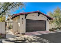 Spanish style home with a two-car garage and gated entry at 2545 Swan Ln, Las Vegas, NV 89121