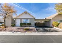 Single-story house with carport and landscaping at 709 Jonathan Glen Way, Las Vegas, NV 89145