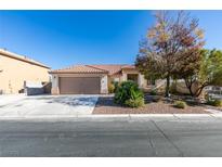 Single-story house with brown garage door and landscaped front yard at 3816 Sunking St, Las Vegas, NV 89130