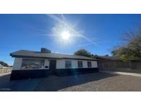 Updated single-story home with modern exterior and gravel driveway at 4257 Ridgedale Ave, Las Vegas, NV 89121