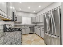 Modern kitchen featuring stainless steel appliances and granite countertops at 5250 S Rainbow Blvd # 2158, Las Vegas, NV 89118