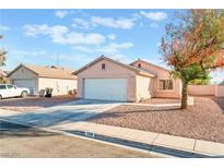 Single-story house with a two-car garage and desert landscaping at 2318 Cambridge Elms St, North Las Vegas, NV 89032