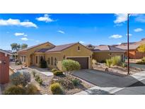 Single-story house with desert landscaping, two-car garage, and neutral-colored exterior at 1318 Springdale Ln, Mesquite, NV 89034