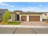 Single-story home with two-car garage and landscaped front yard at 9632 Lapis Ln, Las Vegas, NV 89143