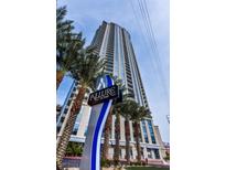Allure Las Vegas highrise building with palm trees and signage at 200 W Sahara Ave # 601, Las Vegas, NV 89102