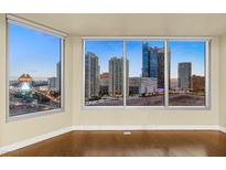 Living room with hardwood floors and stunning city views at 222 Karen Ave # 1702, Las Vegas, NV 89109