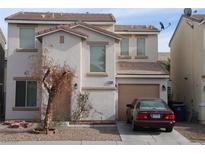 Two-story house with attached garage and landscaping at 2096 Sandy Ln, Las Vegas, NV 89115