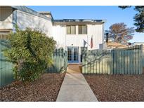 Attractive two-story home with a landscaped yard and a private walkway at 4045 Village Sq, Las Vegas, NV 89121