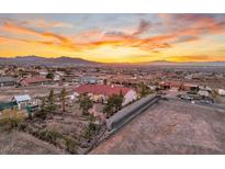 Aerial view of a house with a large yard, showcasing the property's expansive size and beautiful sunset views at 531 N Milan St, Henderson, NV 89015