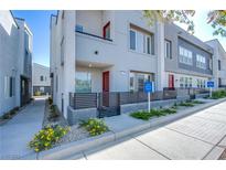 Modern two-story townhome with attached garage and landscaped walkway at 31 Newport Edge Pl, Henderson, NV 89015