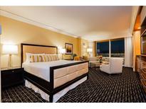 Luxurious bedroom with king-size bed, and city views at 2000 Fashion Show Dr # 5319, Las Vegas, NV 89109