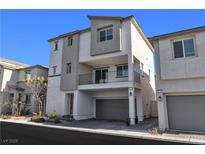 Two-story modern home with gray siding and a two-car garage at 6952 Crescent Gold St, North Las Vegas, NV 89086