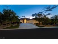 Beautiful single-story home with landscaped yard and driveway at 7561 Prancing Pony Ct, Las Vegas, NV 89131
