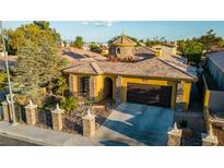 Luxury home with unique architectural details and a landscaped front yard at 8223 Windrush Ave, Las Vegas, NV 89117