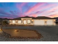 Beautiful desert home with three-car garage and landscaped yard at 1110 Geofrey St, Pahrump, NV 89060