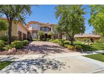 Two-story house with stone accents and landscaped yard at 1278 Imperia Dr, Henderson, NV 89052