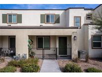 Modern townhouse exterior with a covered patio and landscaped walkway at 3585 Arcadian Sea St, Las Vegas, NV 89106