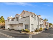 Two-story stucco townhome with attached garage and desert landscaping at 5201 S Torrey Pines Dr # 1172, Las Vegas, NV 89118