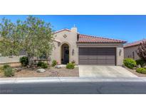 Single-story home with Spanish-style architecture, two-car garage, and landscaped front yard at 5658 Pleasant Palms St, North Las Vegas, NV 89081