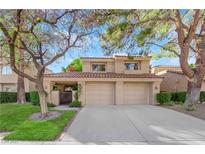 Two-story home with three-car garage and landscaped front yard at 4941 Tierra Del Sol Dr, Las Vegas, NV 89113